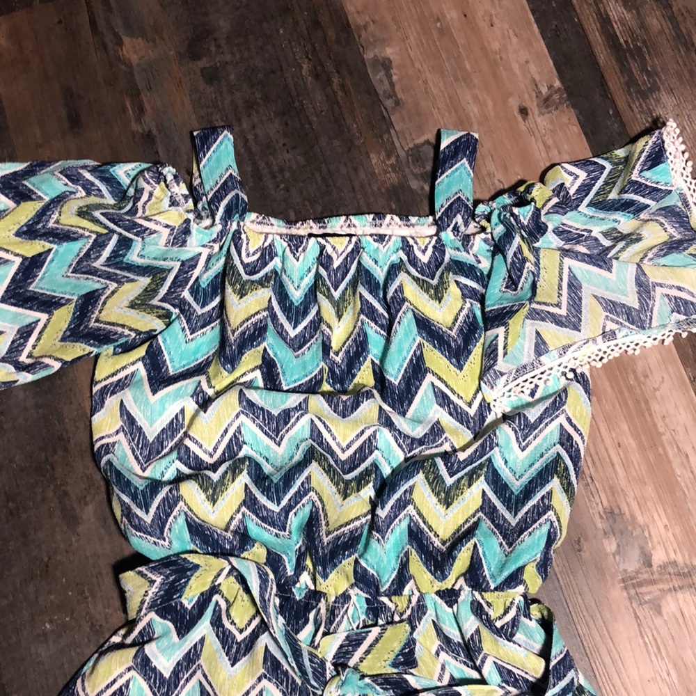 Adorable girls’ short romper with high low skirt
